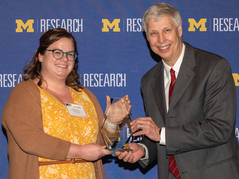 Kadi Brinson, ULAM Executive Assistant, receives OVPR Award from Bradford Orr, Associate VP, Natural Sciences and Engineering