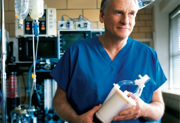 Dr. Robert Bartlett holds ECMO medical device