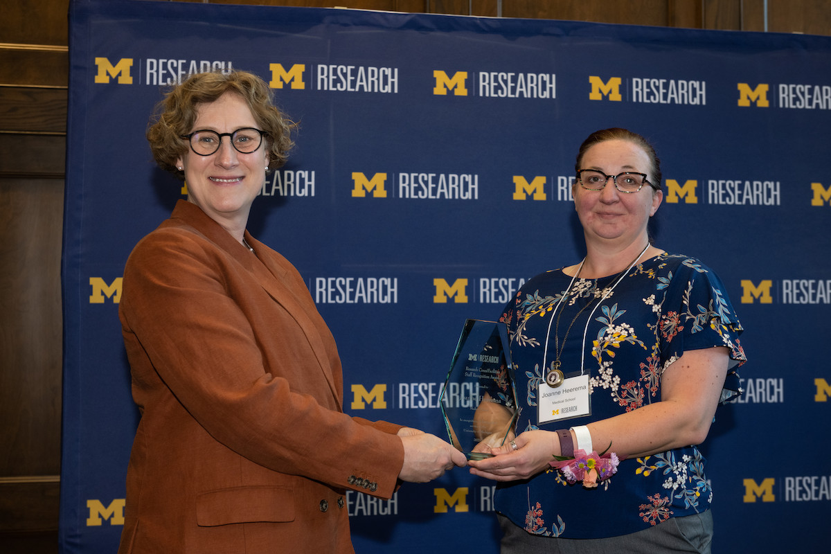 U-M Vice President for Research & Innovation Rebecca Cunningham, M.D., presents OVPR Award for Exemplary Service to Joanne Heerema, Necropsy Technician in the ULAM Pathology Core